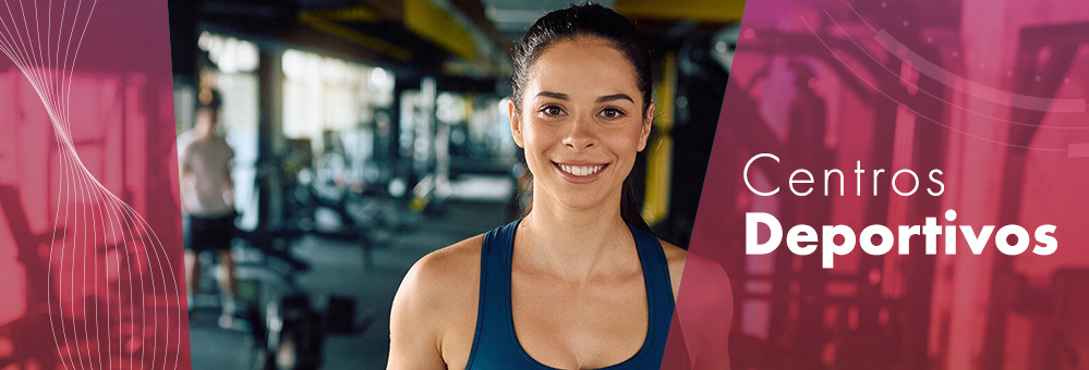 Imagen chica haciendo ejercicio en una bici estática en sala fitness