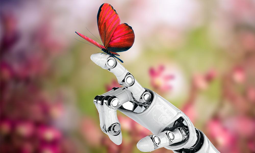 Imagen de la mano de un robot con una mariposa
