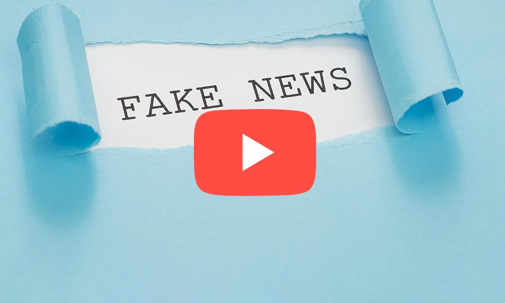 Sobre un papel se ve escrita las palabras Fake News