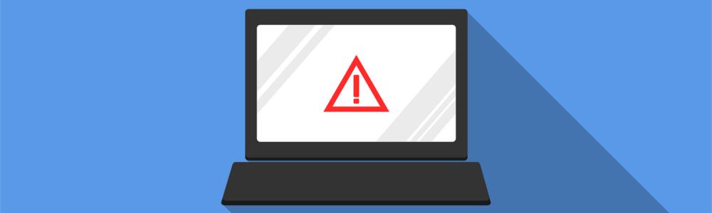 Imagen de un portatil con una advertencia de seguridad en su pantalla